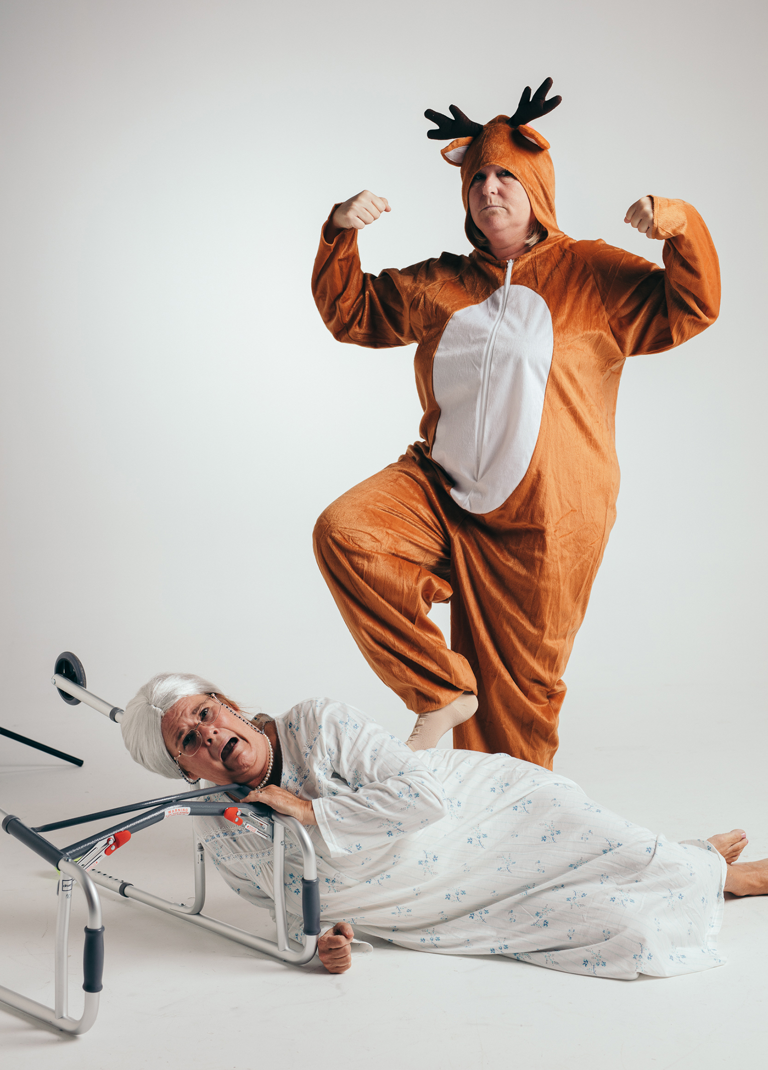 A man dressed as a reindeer and a woman dressed as a reindeer.