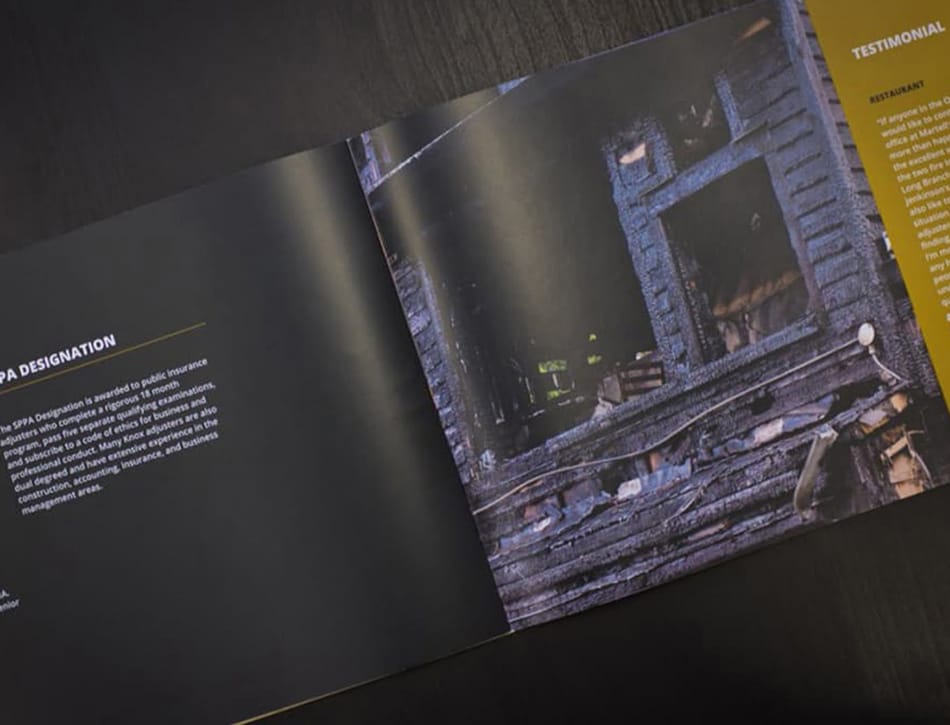 An open book with a picture of a building.